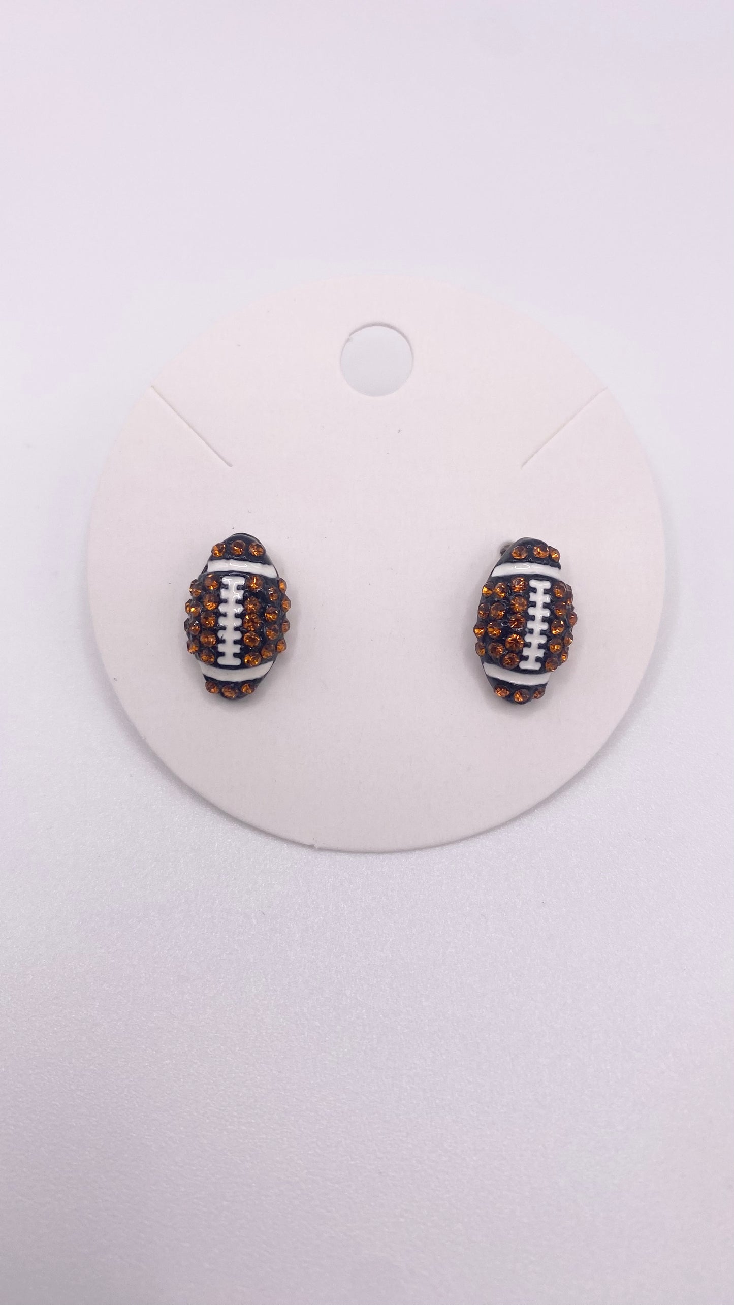 Bling football stud earrings