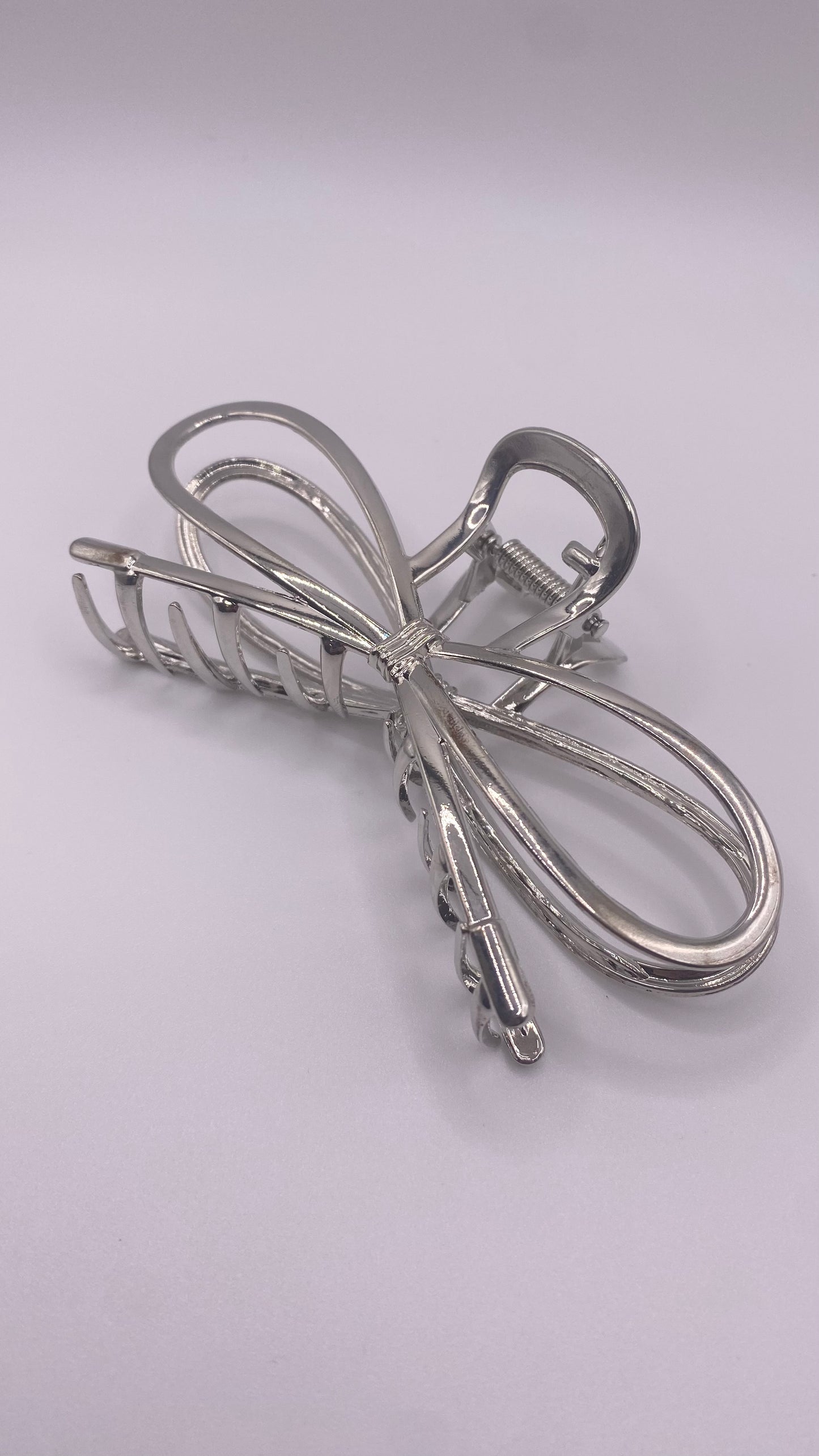 Shiny silver butterfly clip